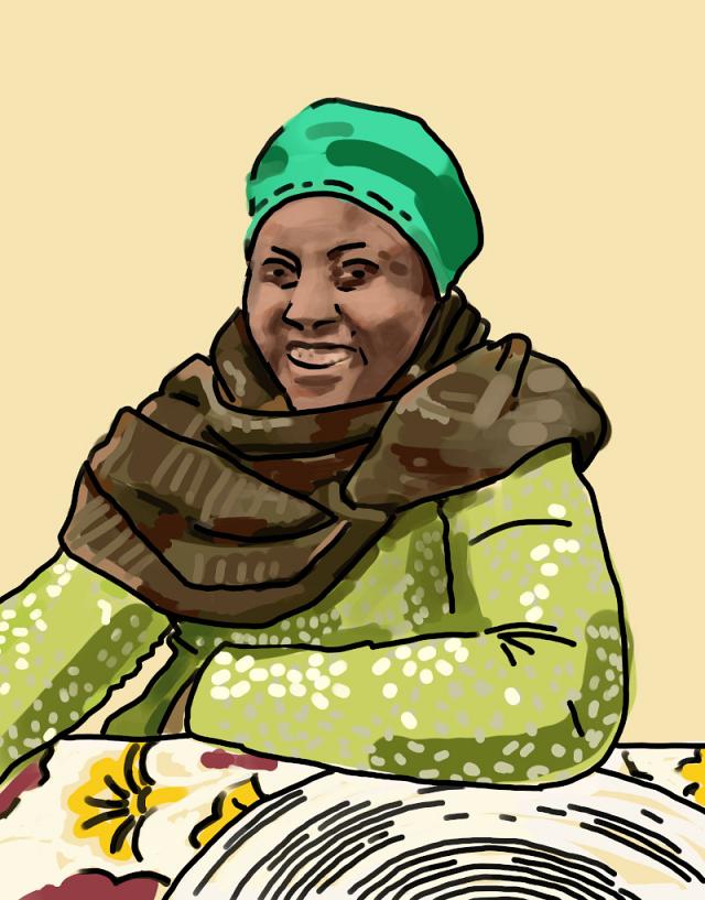 Ketty souriante avec une grosse écharpe parce qu'il fait froid